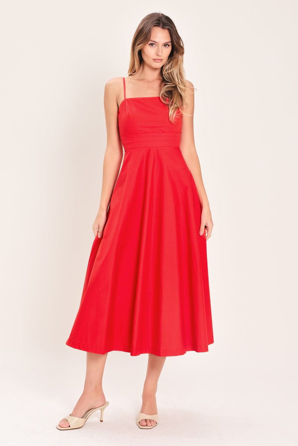 Modern Romance Woven Midi Dress in Red with straight neckline, straps, pleated waistband, circle skirt, and back zipper closure shown on model