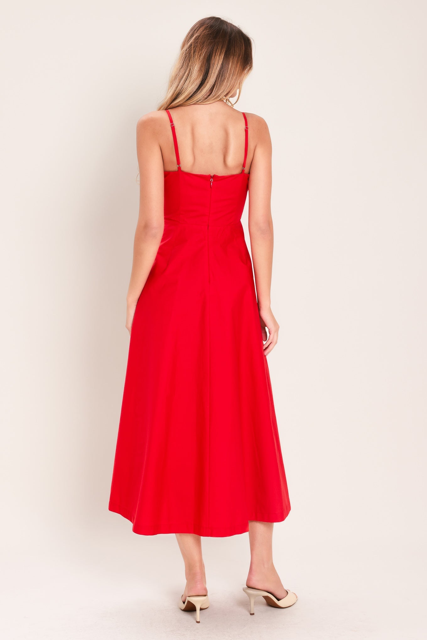 Modern Romance Woven Midi Dress in Red with straight neckline, straps, pleated waistband, circle skirt, and back zipper closure shown on model