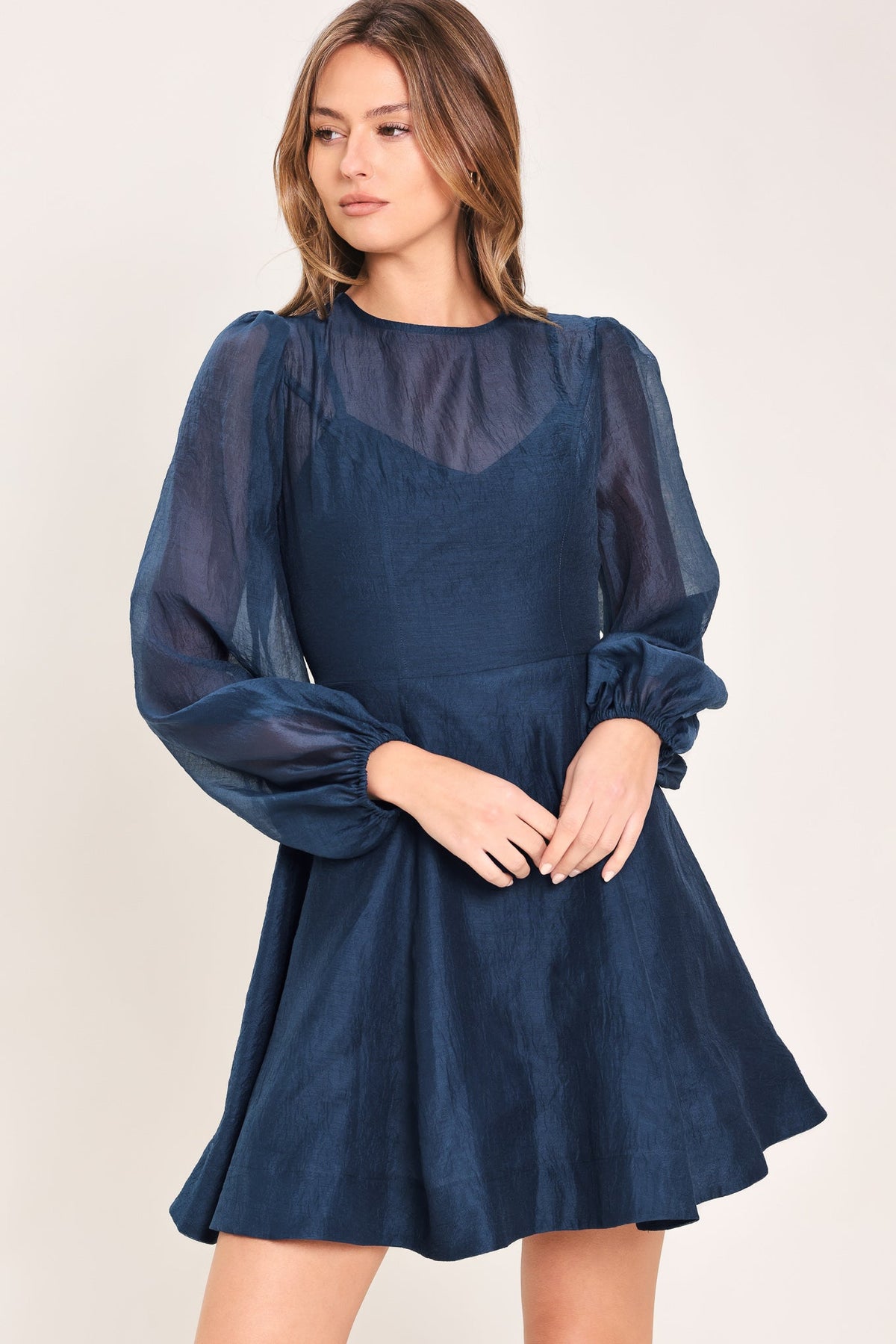 Sheer Sleeve Circle Skirt Mini Dress in navy, side view