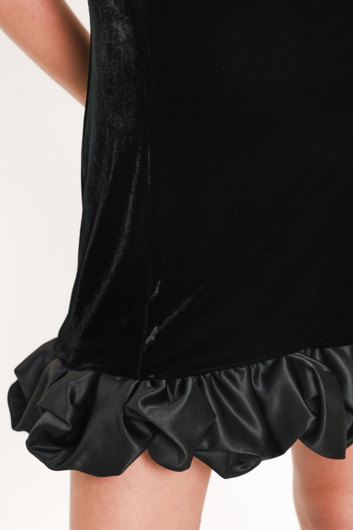 Contrast Bubble Hem Mini Dress in black, close-up detail