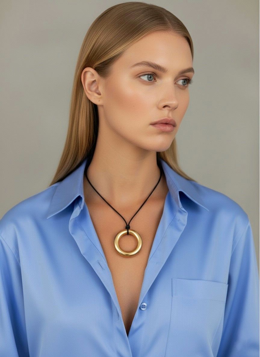 Sunline Necklace - side view showing leather rope and medallion