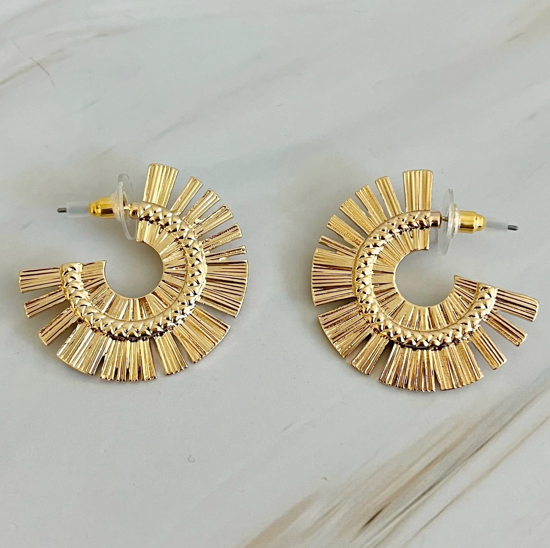 Sunburst Beauty Hoop Earrings - flat lay view Gold and Silver