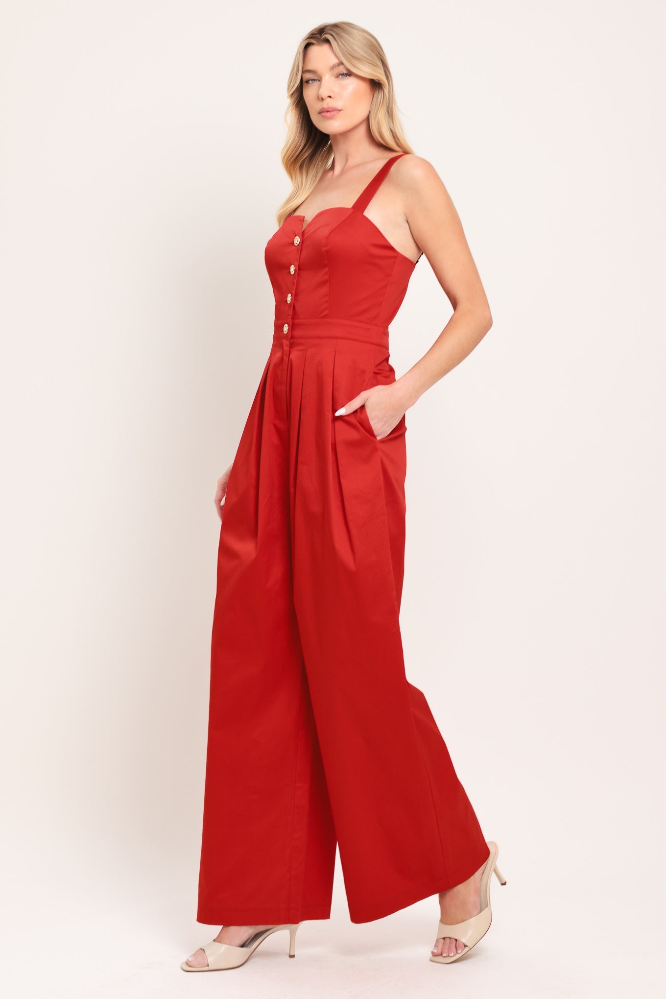 Woven jumpsuit with button-front closure and side pockets