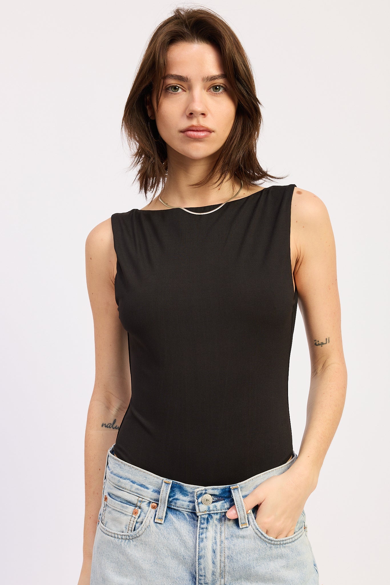 Solara Bodysuit in Black - front view showing boat neck silhouette
