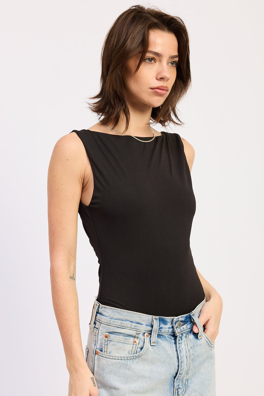 Solara Bodysuit in Black - back view showing trim detail