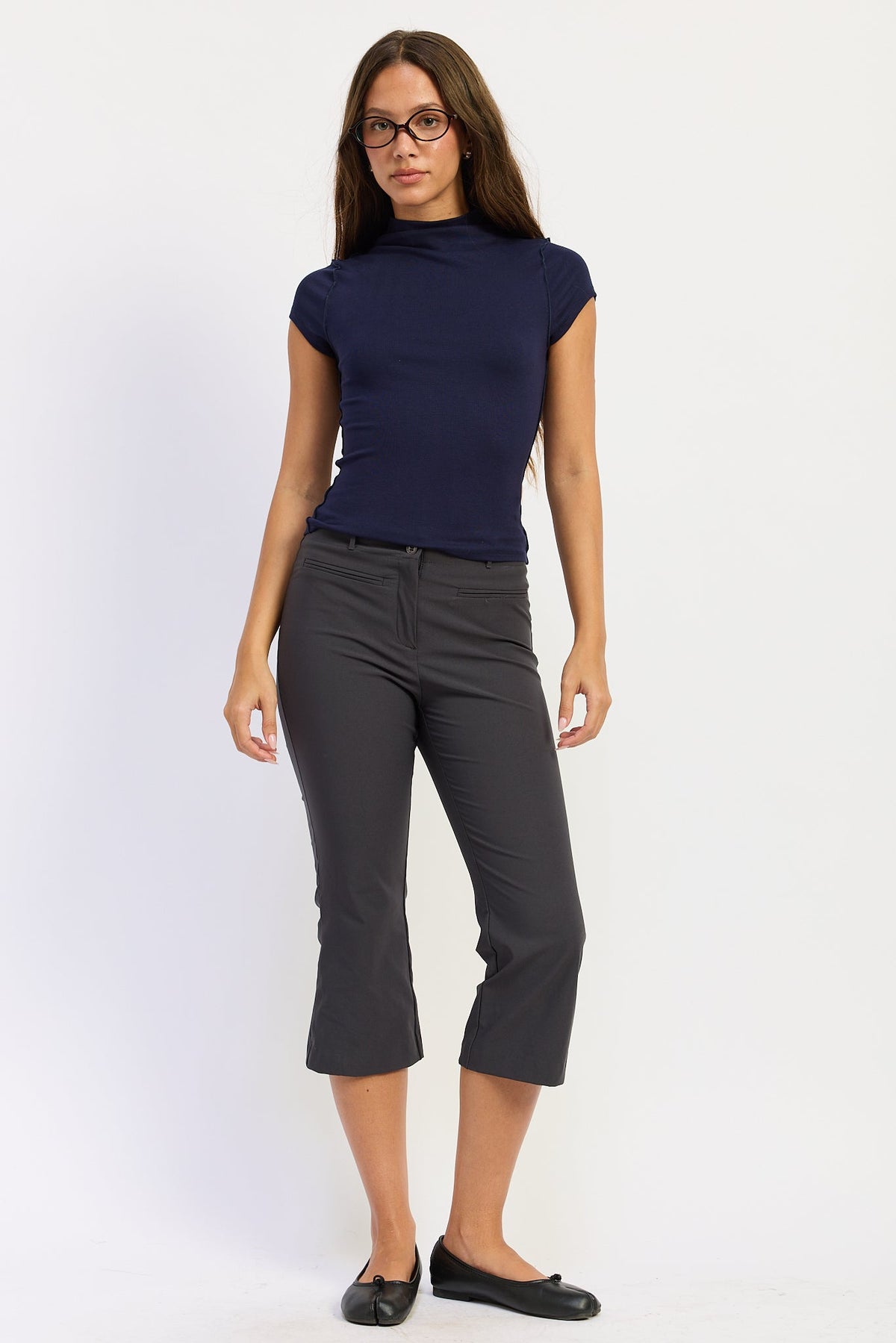 Mock Neck Exposed Seam Knit Top in navy, front view