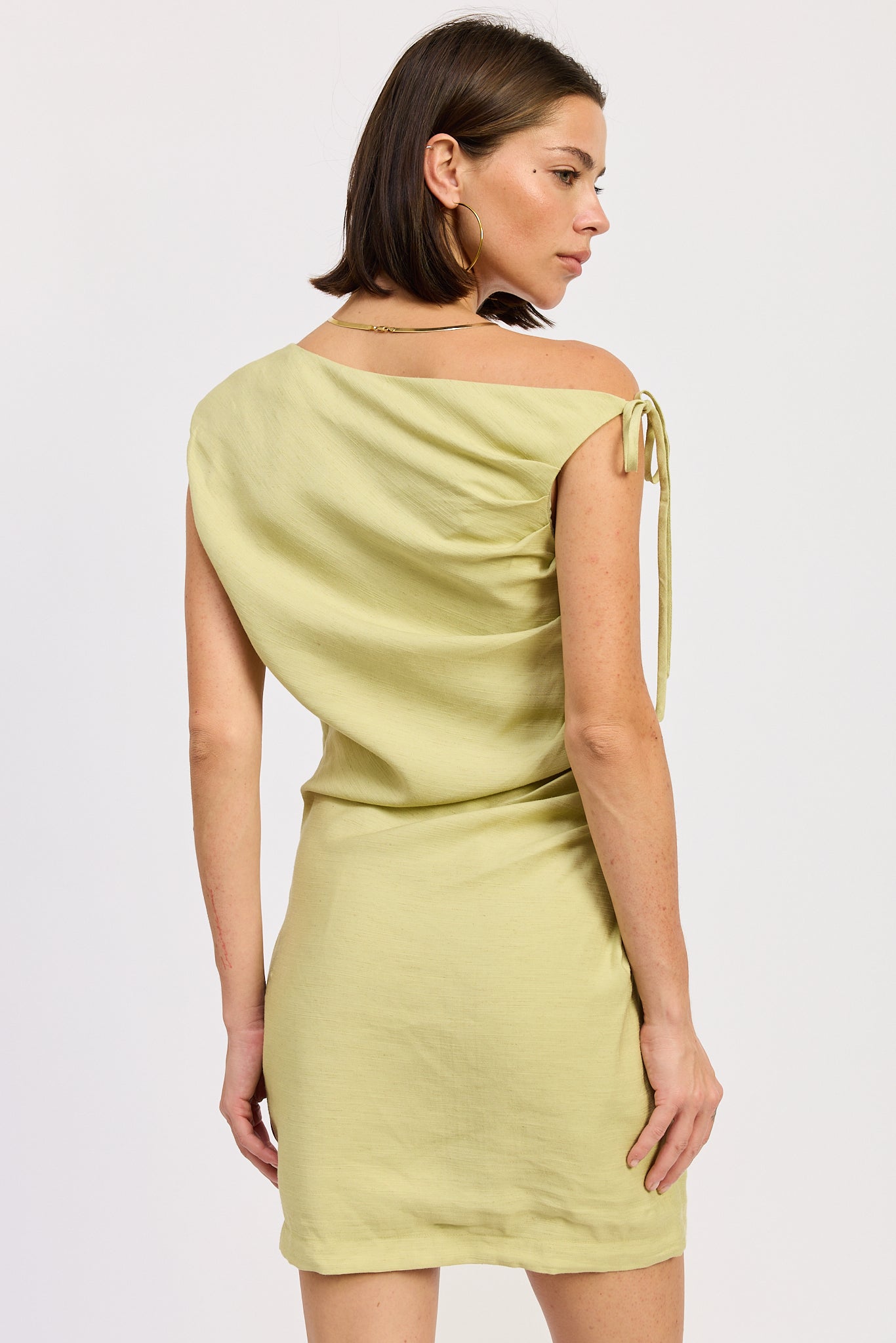 Riven Mini Dress in Lime - close up of side tie detail