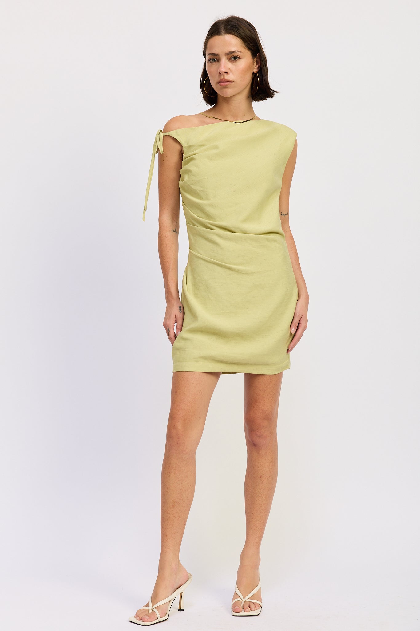 Riven Mini Dress in Lime - front view showing asymmetrical side tie