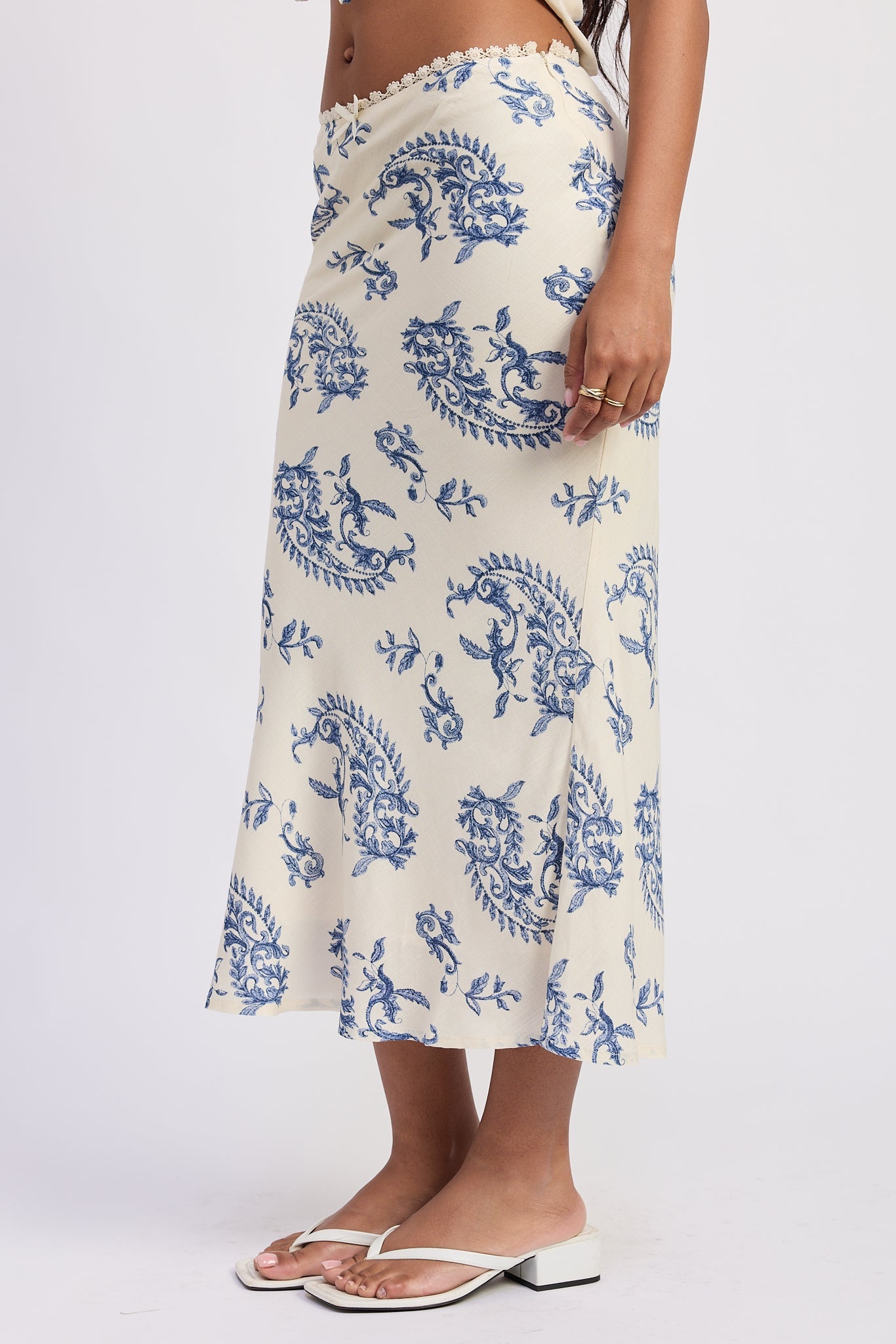 Amarine Midi Skirt in Ivory Blue - back view showing flared hem