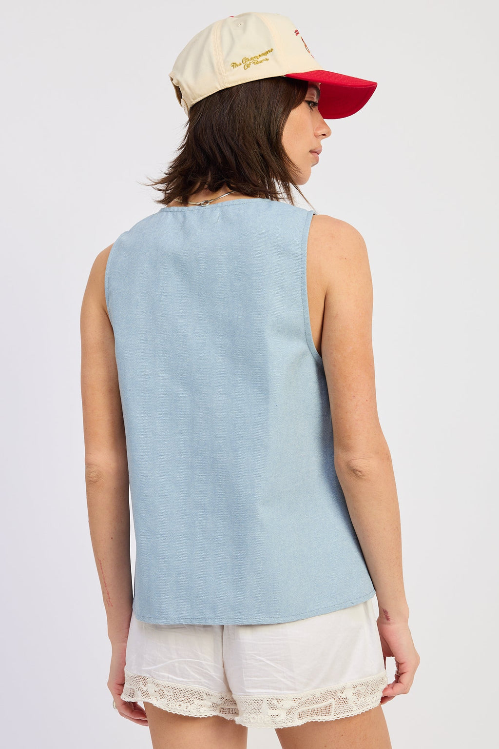 Nisa Vest Top in Washed Blue - styled open over bralette