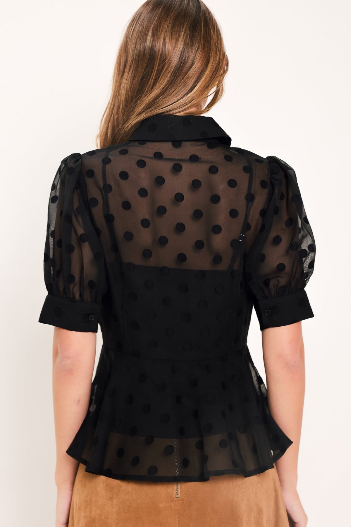 Polka Dot Puff Sleeve Peplum Top in black, back view
