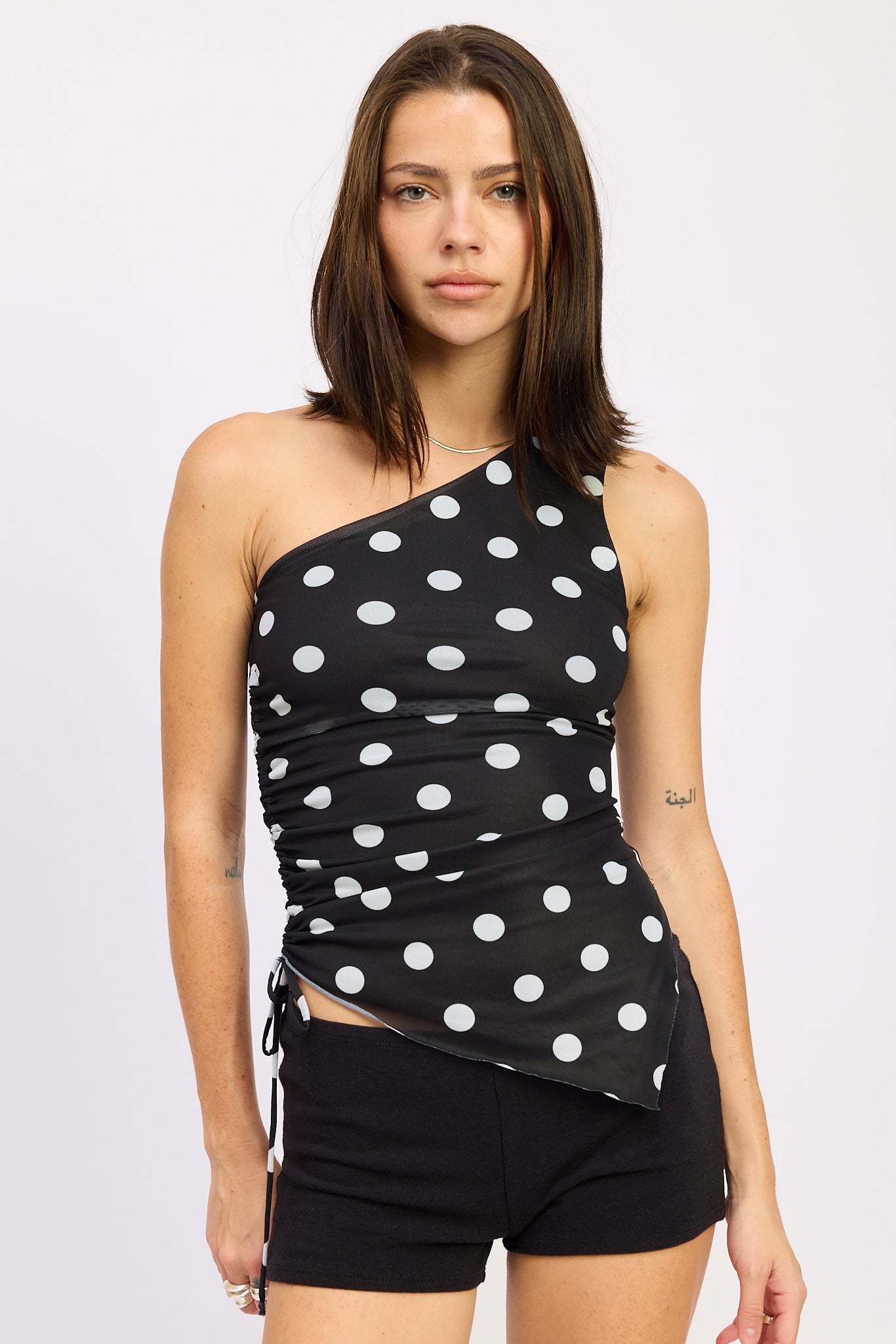 Alessandra Top in Black White - front view showing one shoulder and side ruching