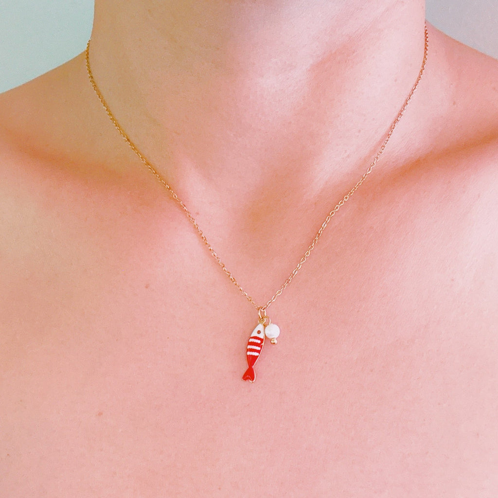 Striped Fish and Pearl Necklace - flat lay detail