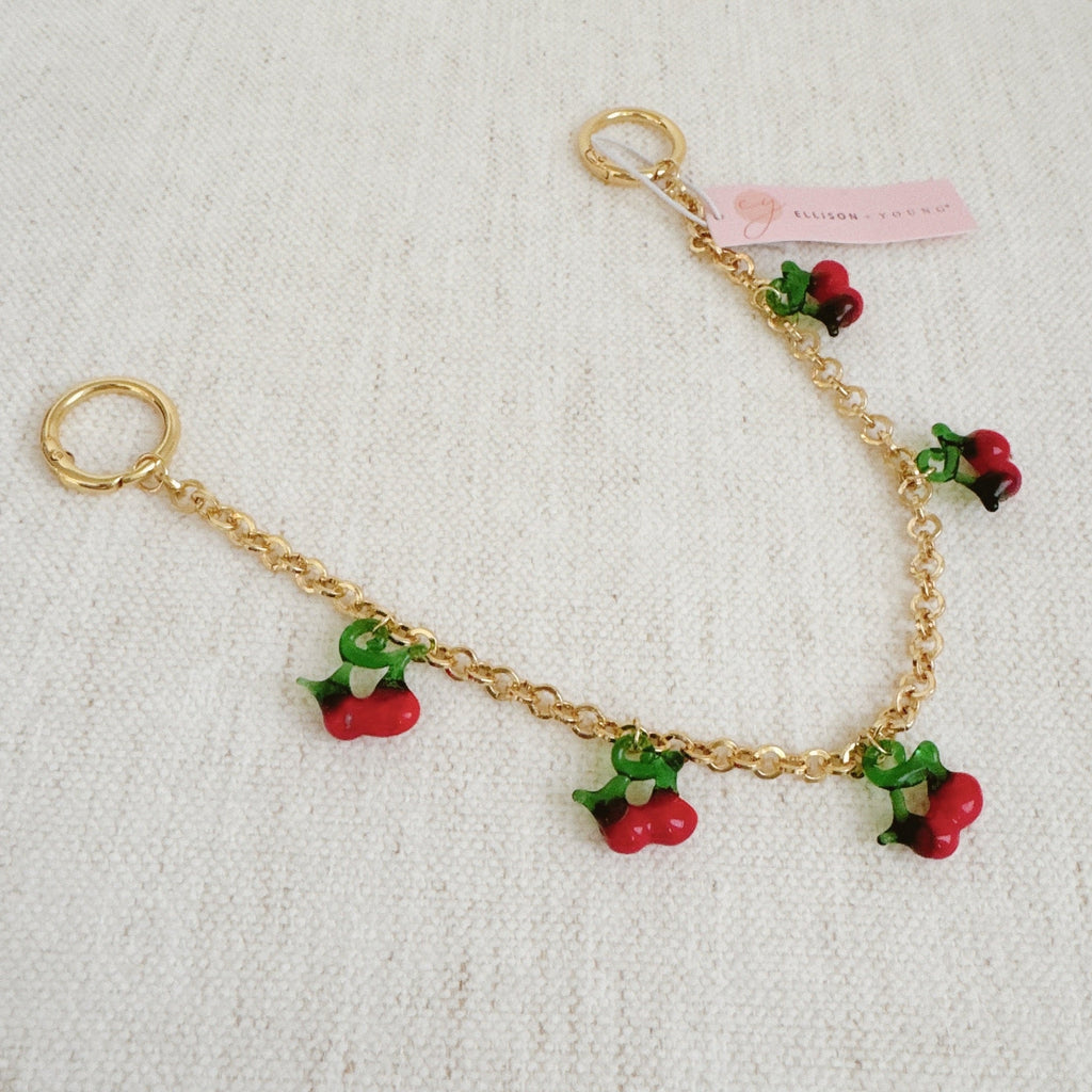 Sweet Cherry Drops Bag Charm - flat lay view