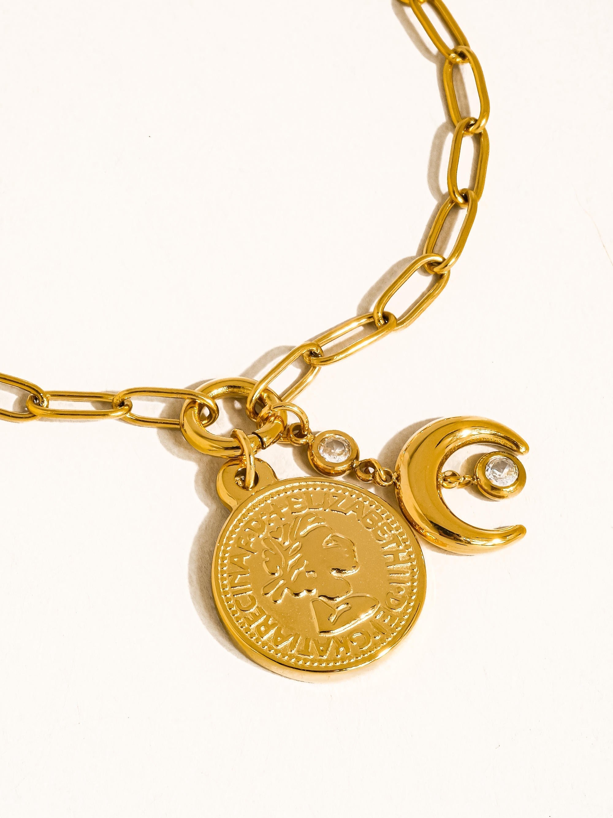 Vesta Bracelet - close up of coin medallion and moon charm detail