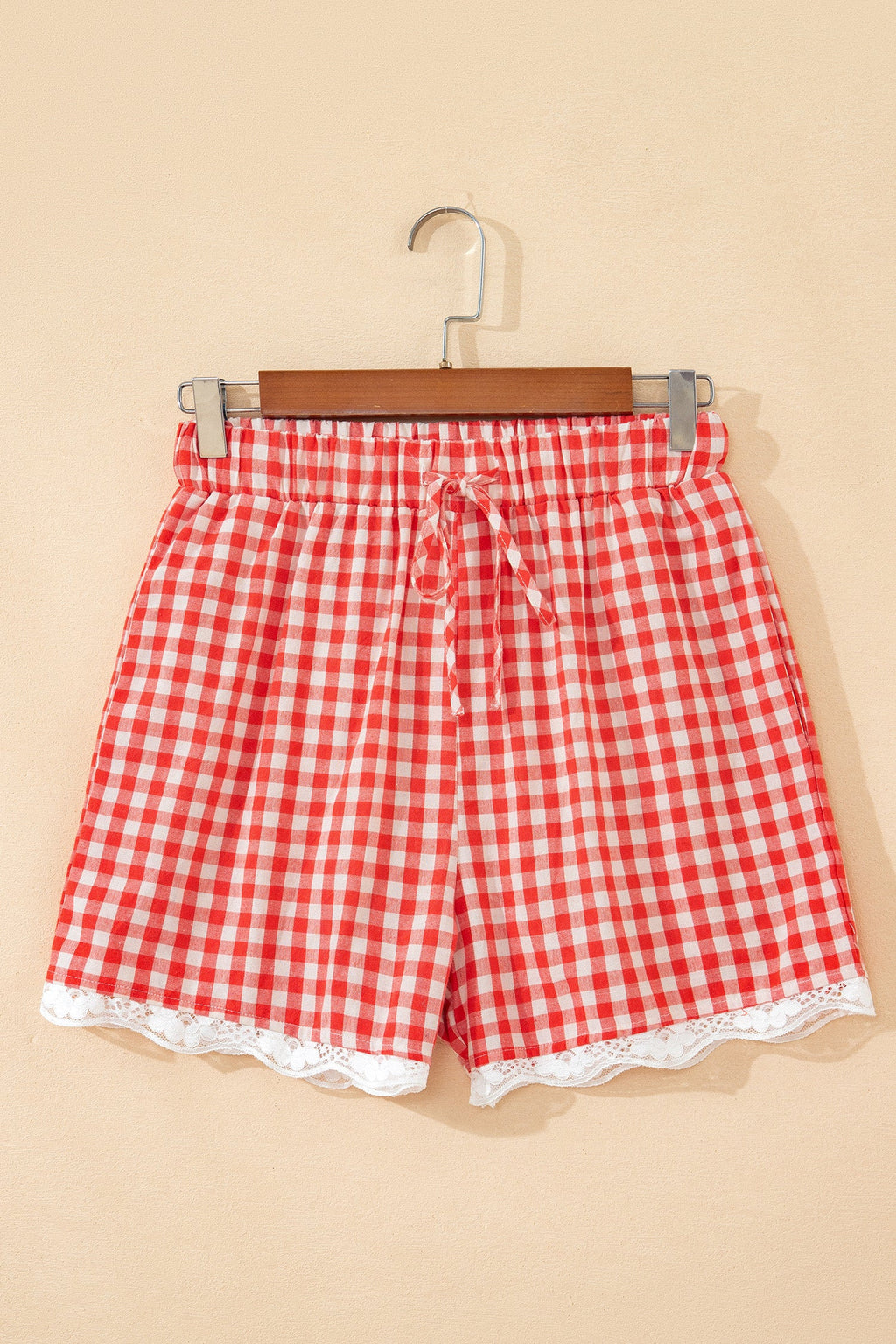 Gingham Plaid Tie Waist Lace Hem Shorts in Red with gingham print, front tie waist, and lace hem trim shown on model
