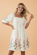 Floral Puff Sleeve Babydoll Dress in Beige with floral print, square neckline, puff short sleeves, and high waist silhouette shown on model