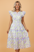 Floral Tulip Contrast Trim Midi Dress in Purple with floral print, colorblock contrast trim, flutter sleeves, and relaxed shift silhouette shown on model