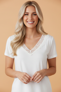 Solid Hollowed Lace Trim V-Neck T-Shirt in White - front view showing lace trim at V-neck