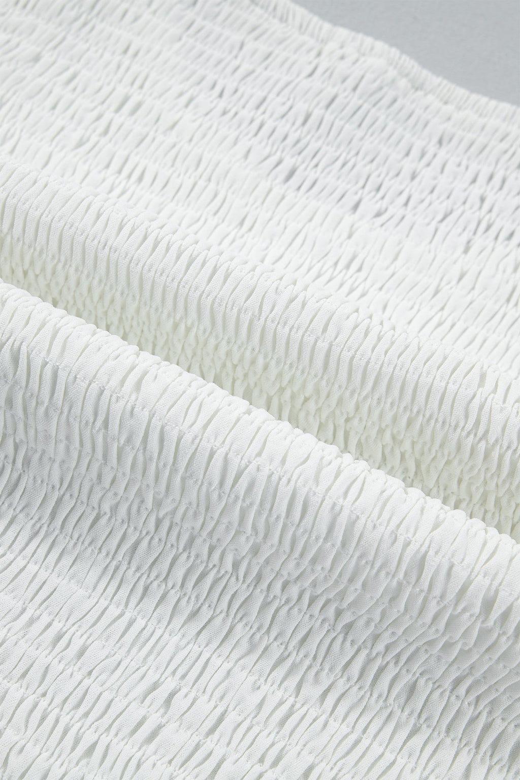 White peplum top fabric detail