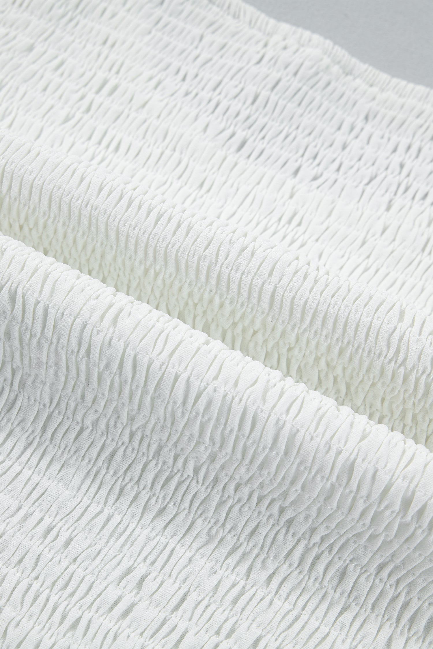 White peplum top fabric detail
