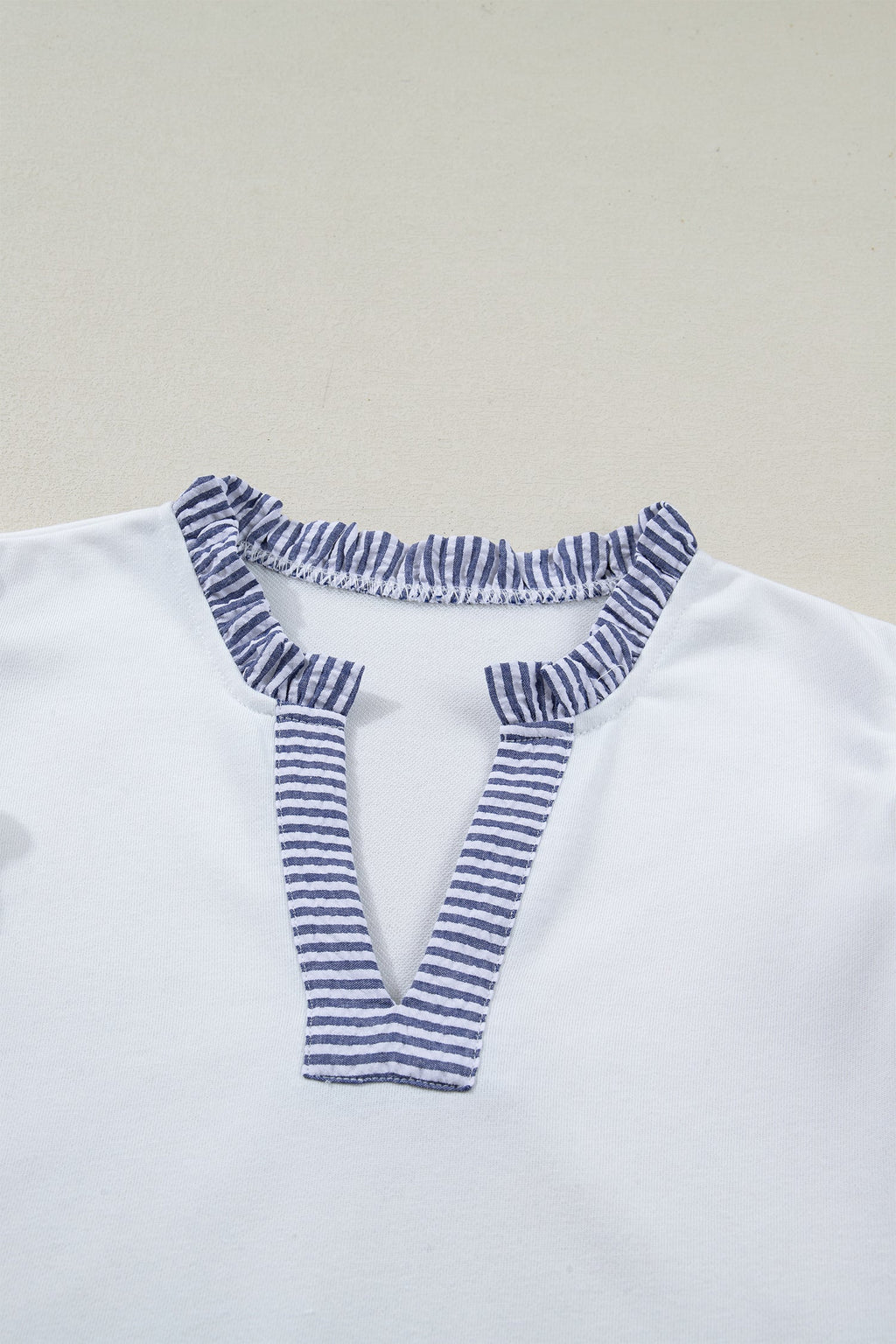 Stripe Patchwork Split Neck Ruffle Trim Sleeveless Dress in White with stripe patchwork, split neckline, double ruffle trim, and sleeveless silhouette shown on model