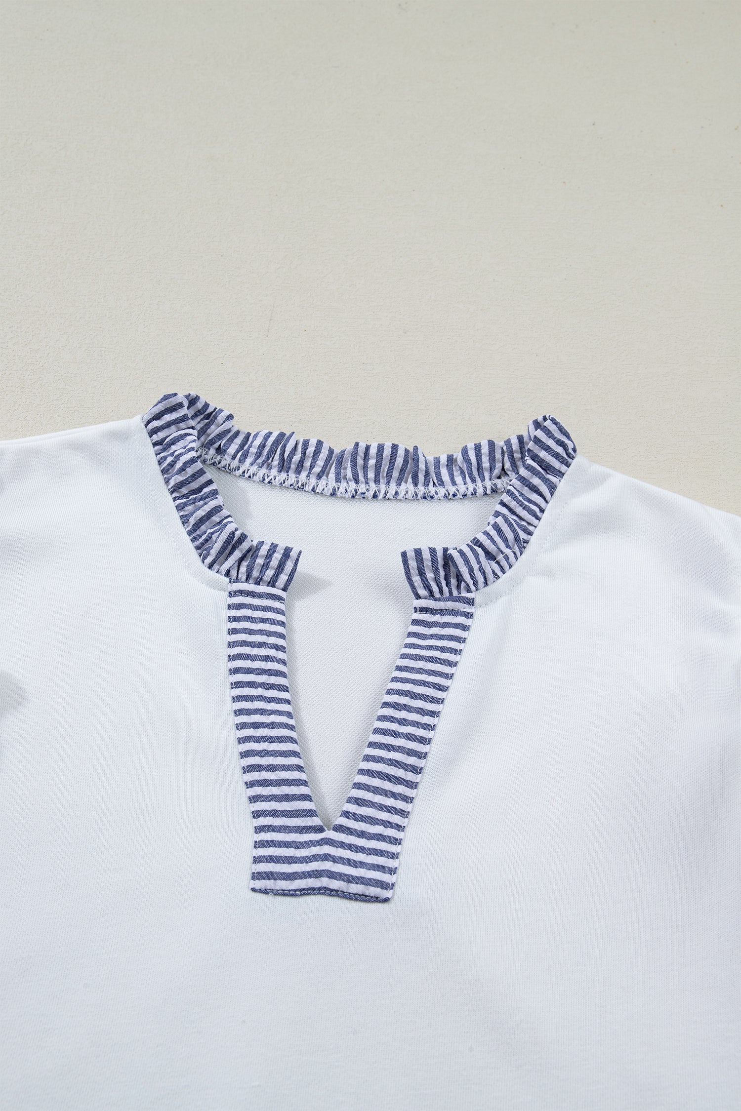 Stripe Patchwork Split Neck Ruffle Trim Sleeveless Dress in White with stripe patchwork, split neckline, double ruffle trim, and sleeveless silhouette shown on model