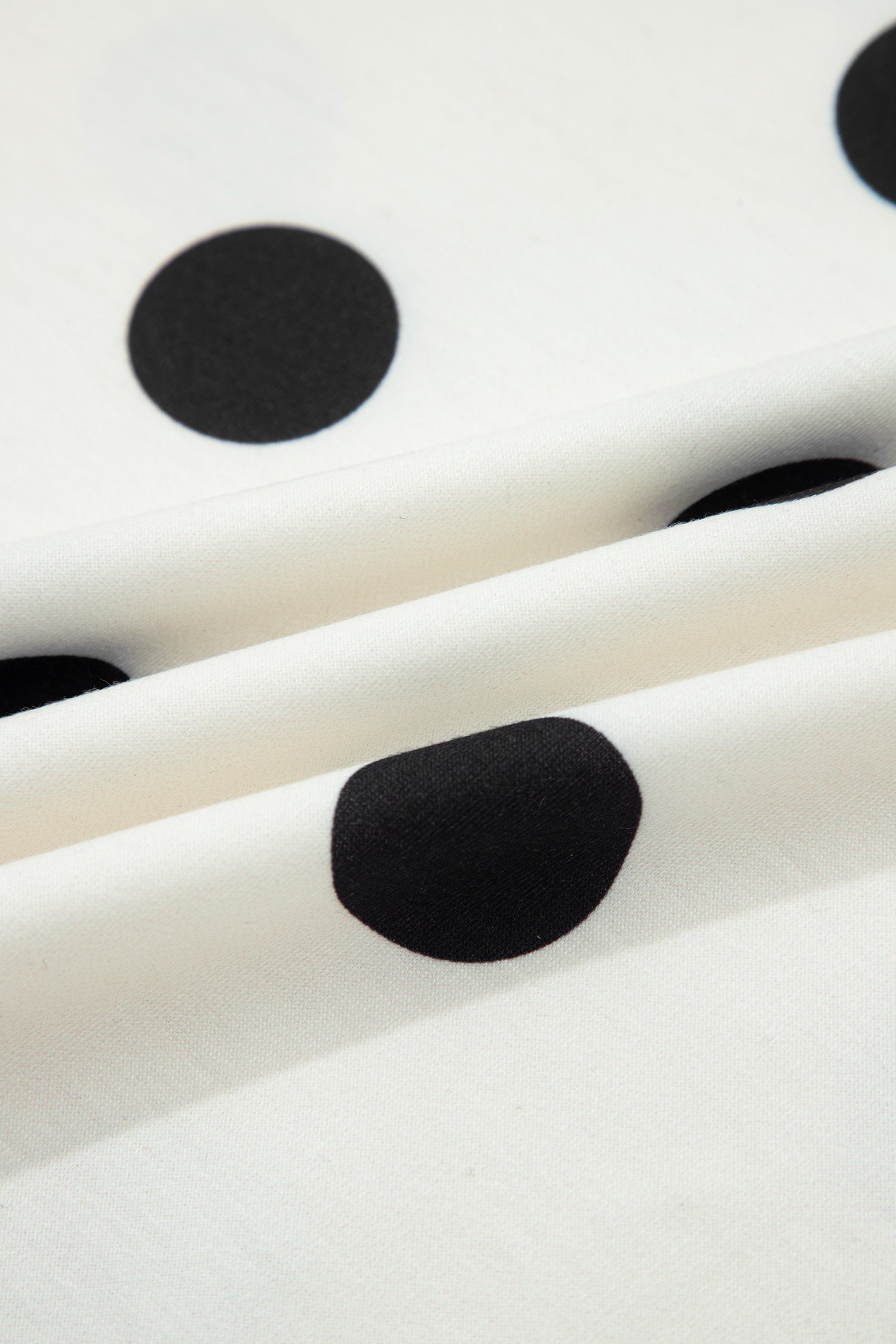 Polka Dot Ribbed Trim Tank and Mini Skort Set in White with polka dot print, ribbed trim tank top, and split mini skort shown on model