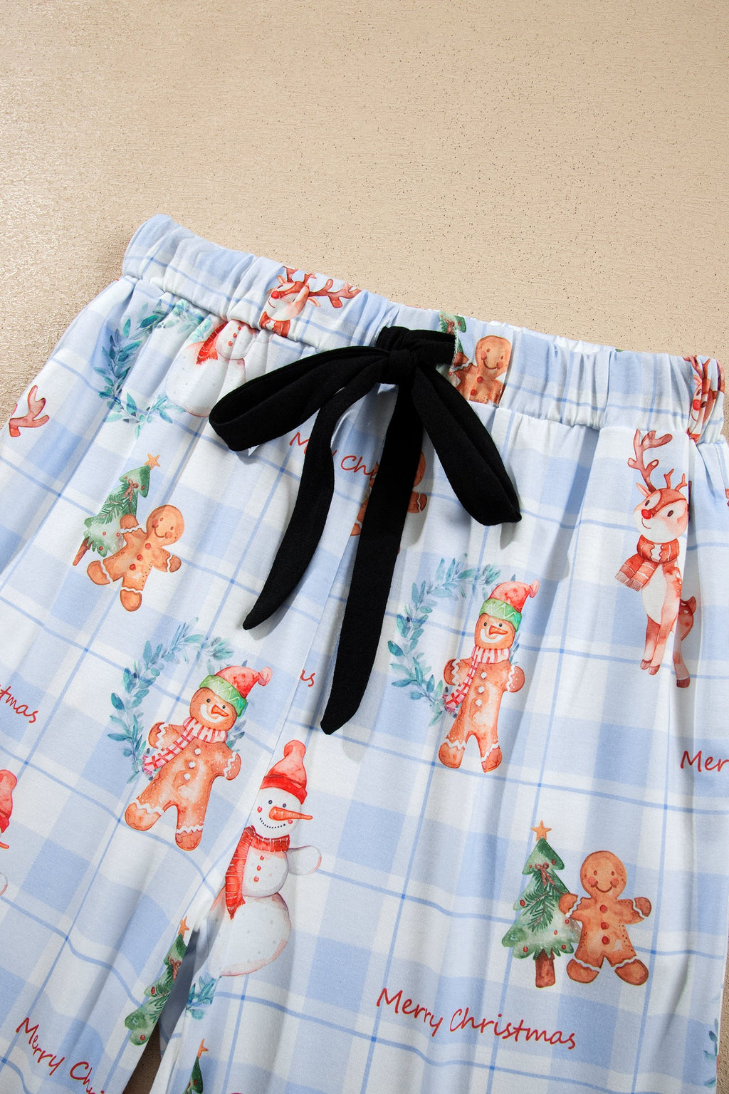 Christmas Plaid Ruffle Pajama Set in sky blue, close-up print detail