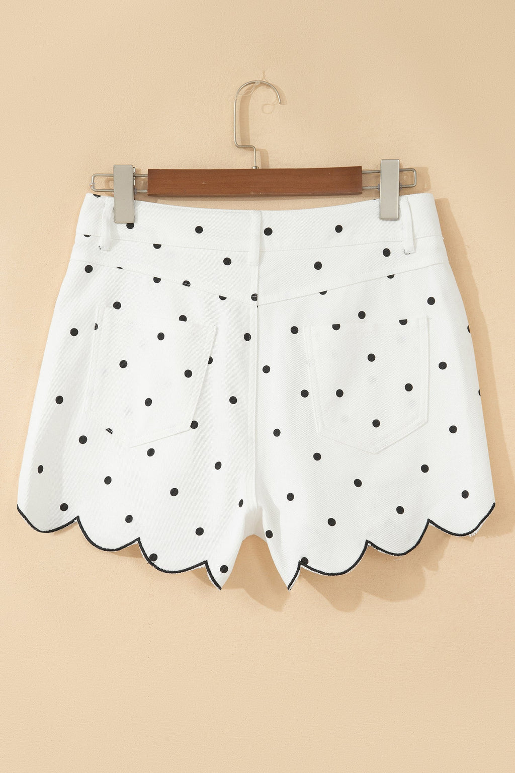 White polka dot denim shorts with metal zipper and insert pockets
