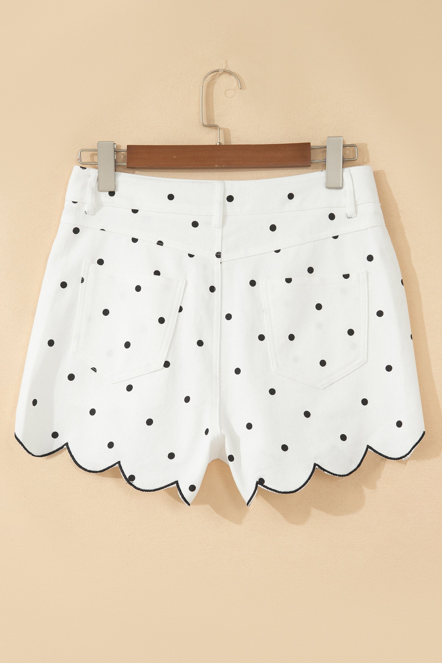 White polka dot denim shorts with metal zipper and insert pockets