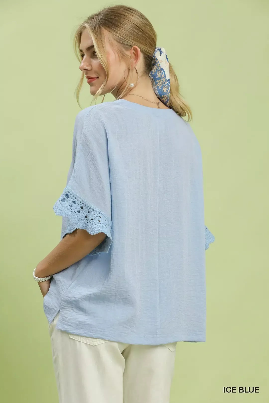 Umgee Crochet Trim Flutter Sleeve Top in Ice Blue - close up of crochet lace trim detail