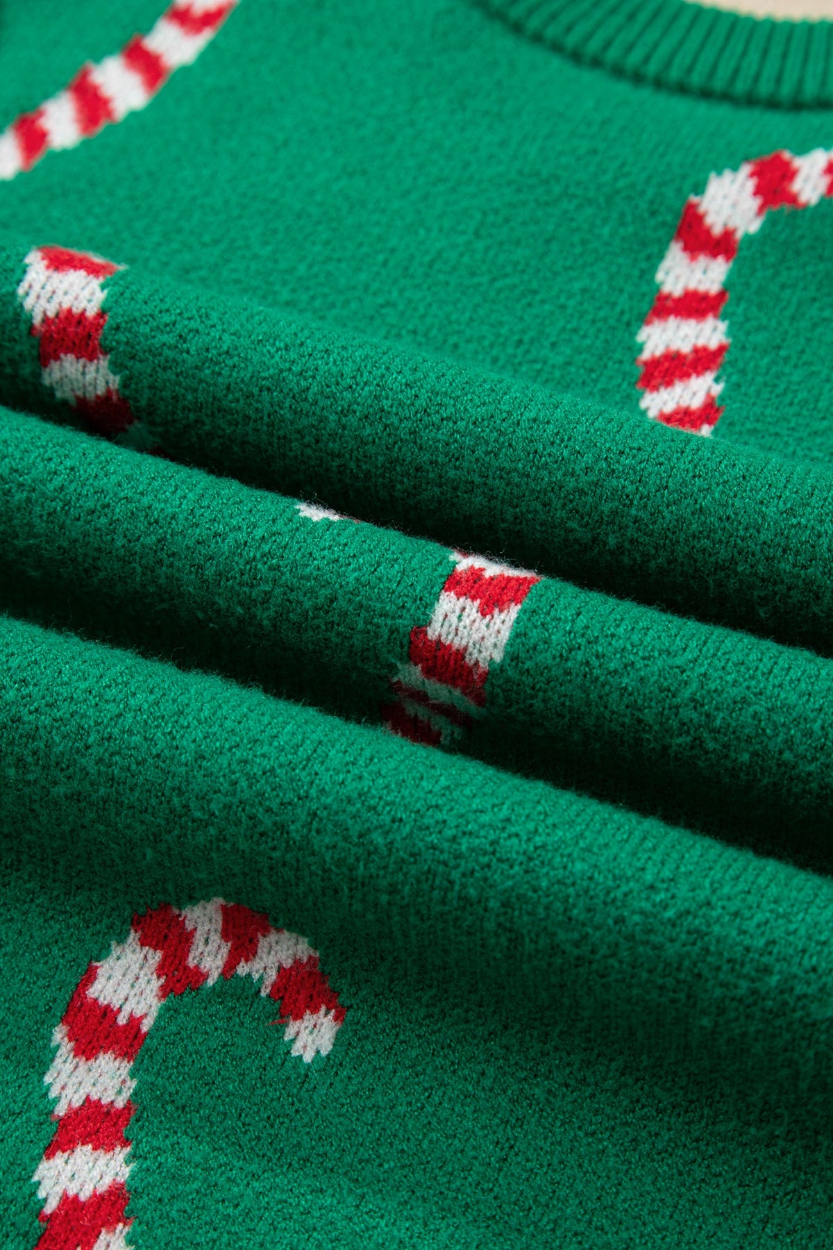 Christmas Candy Cane Drop Shoulder Sweater in dark green and sachet pink, side view