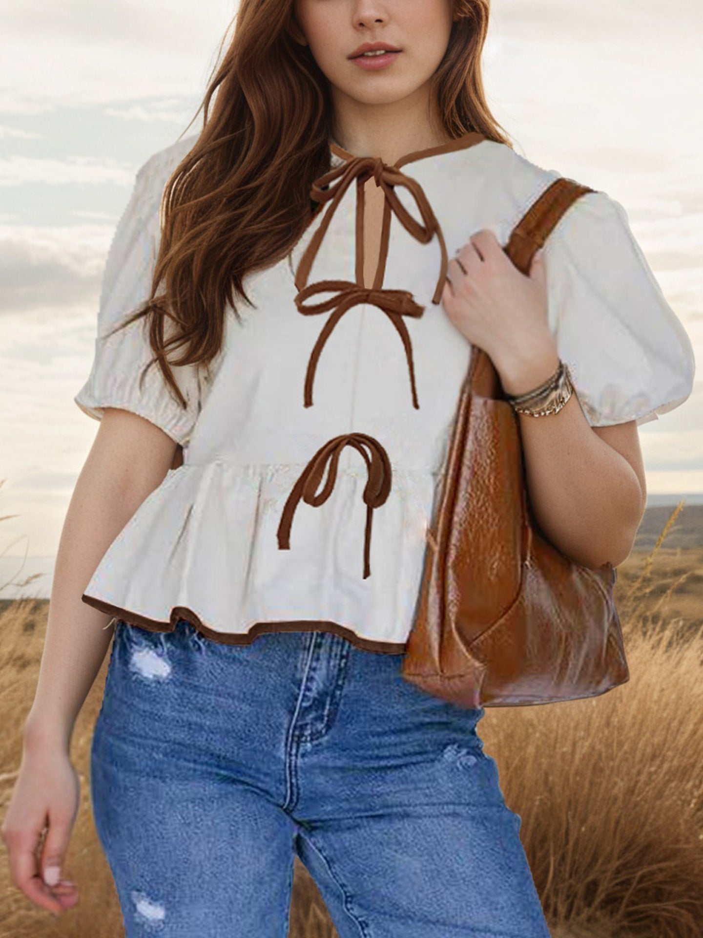 Tie-Front Puff Sleeve Peplum Blouse in Apricot - front view showing tie front and puff sleeves