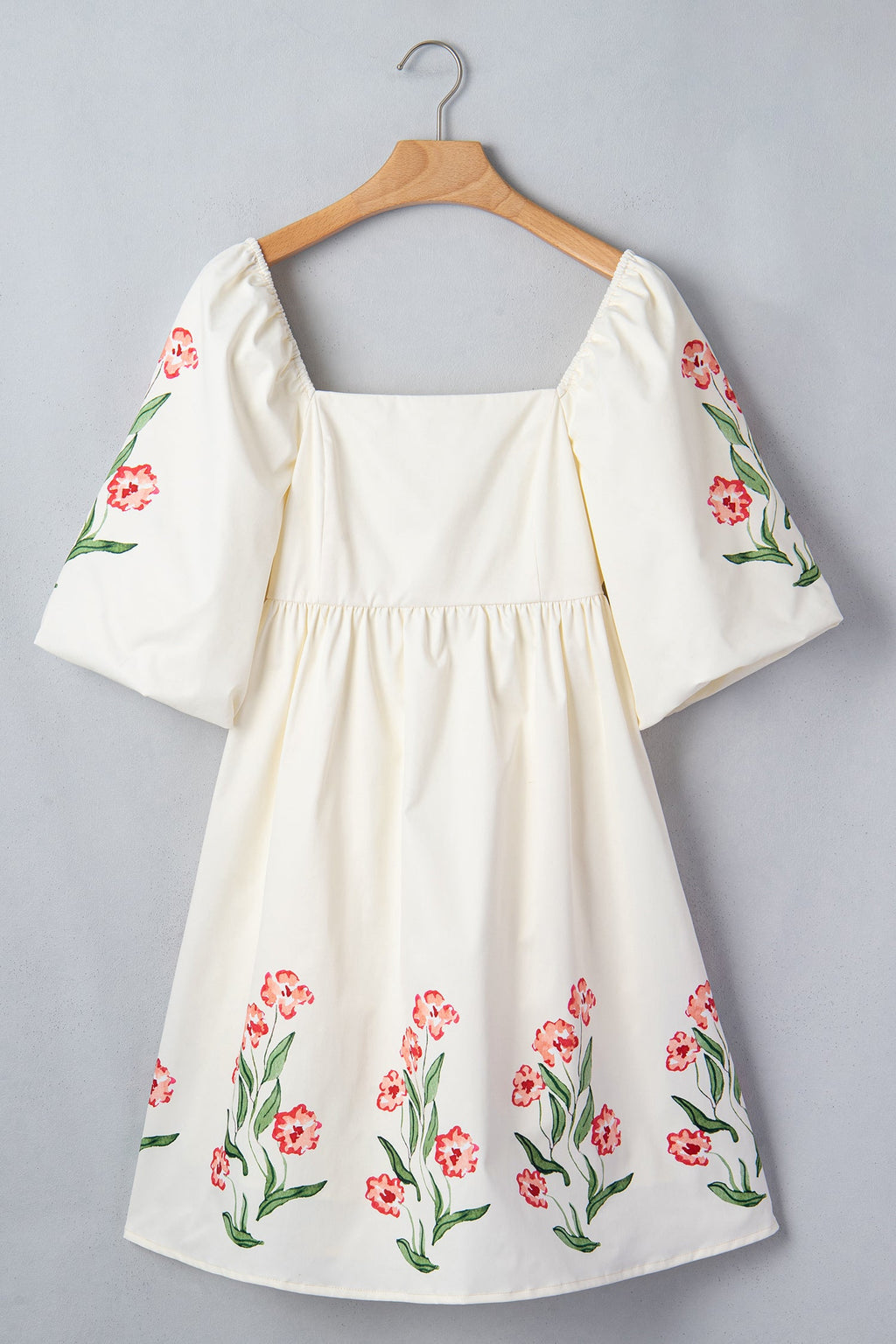 Floral Puff Sleeve Babydoll Dress in Beige with floral print, square neckline, puff short sleeves, and high waist silhouette shown on model