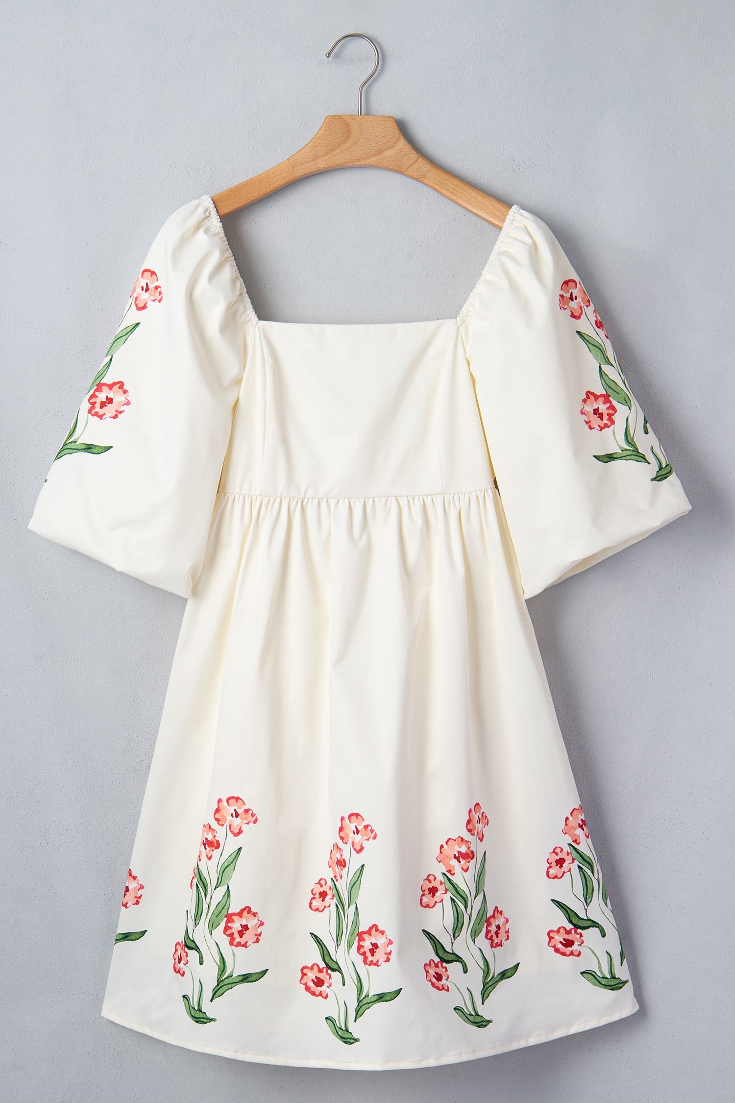 Floral Puff Sleeve Babydoll Dress in Beige with floral print, square neckline, puff short sleeves, and high waist silhouette shown on model