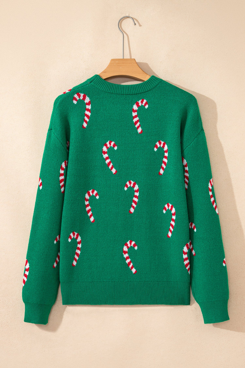 Christmas Candy Cane Drop Shoulder Sweater in dark green and sachet pink, styled view