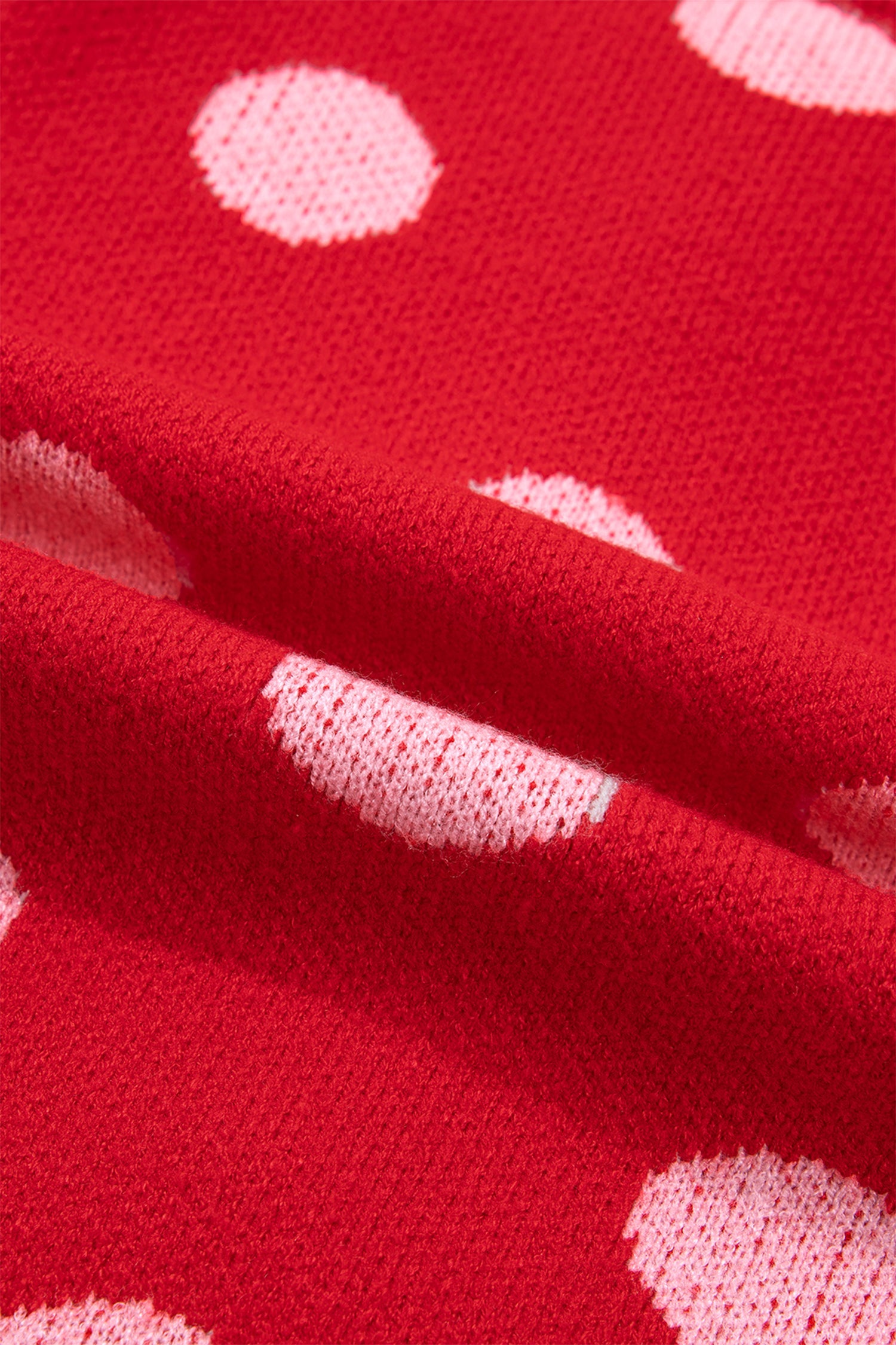 Red knit vest fabric texture detail